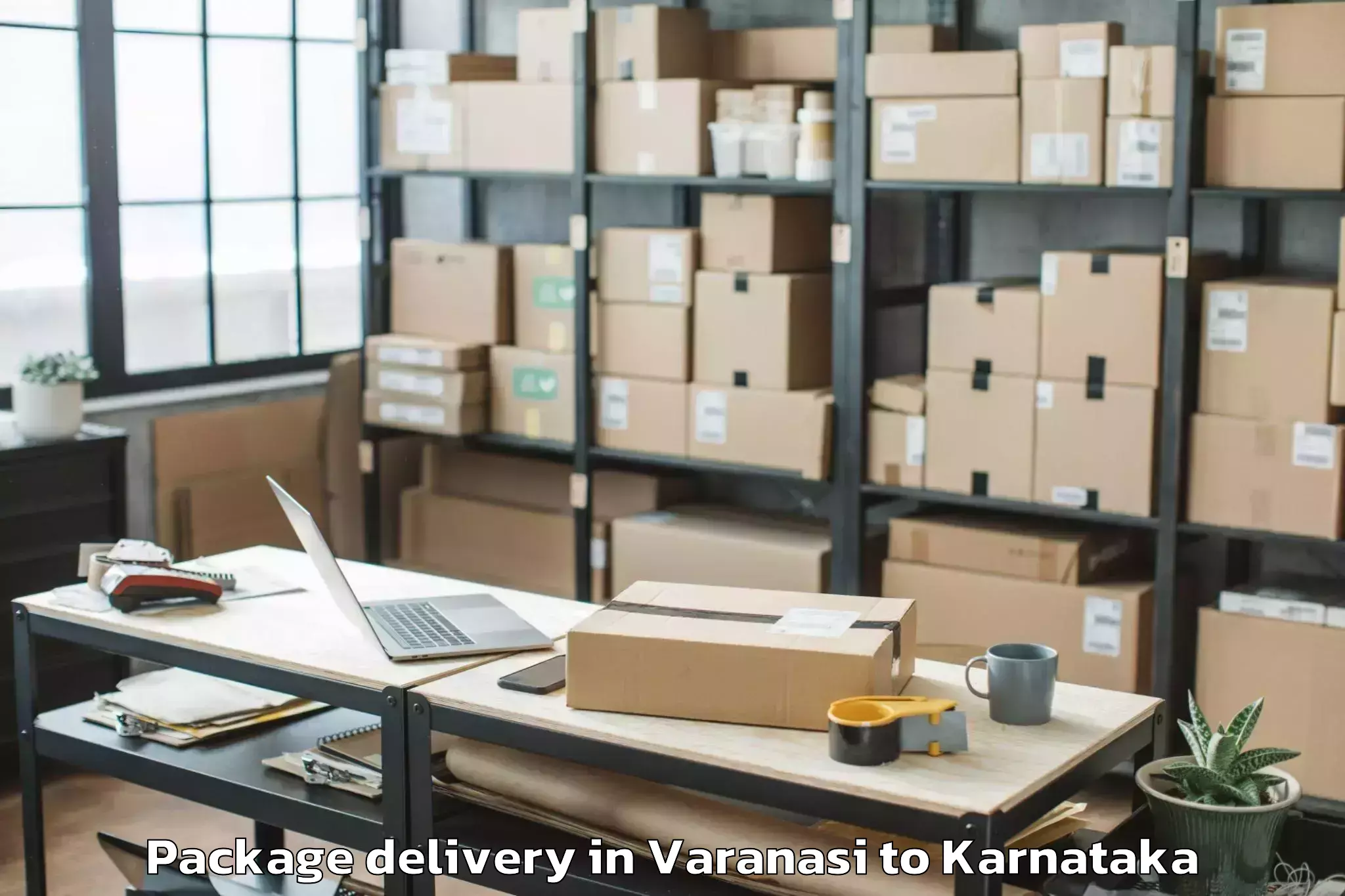 Reliable Varanasi to Karnataka State Law University Package Delivery